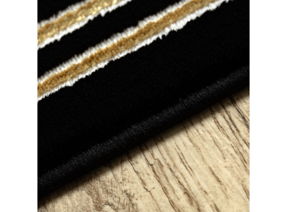 Kusový koberec Allure 1968 black/gold